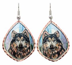 Timber wolf earrings handmade from copper with blue background