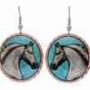 White horsehead earrings with patina blur background