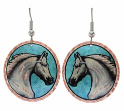 White horsehead earrings with patina blur background