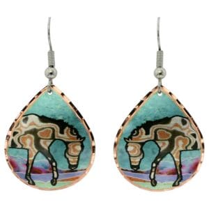 Handcrafted copper earrings featuring Japanese metal art Mokume-gane artwork of a horse on a blue patina background, demonstrating how to create handcrafted jewelry using patinas.