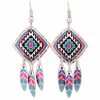 Dangle Southwest Native earrings made in square shape with copper feather dangles