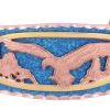 Intricate cut out gold and copper cut out eagle bracelet accentuated with the blue patina background