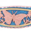 Blue patina copper cuff bracelet decorated with cut out butterfly design in copper and gold colors