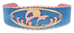 Blue patina copper cuff bracelet decorated with cut out dolphins design in copper and gold colors