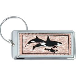 Killer whales keychains handmade from copper accentuated with silver and black colors. No polishing required
