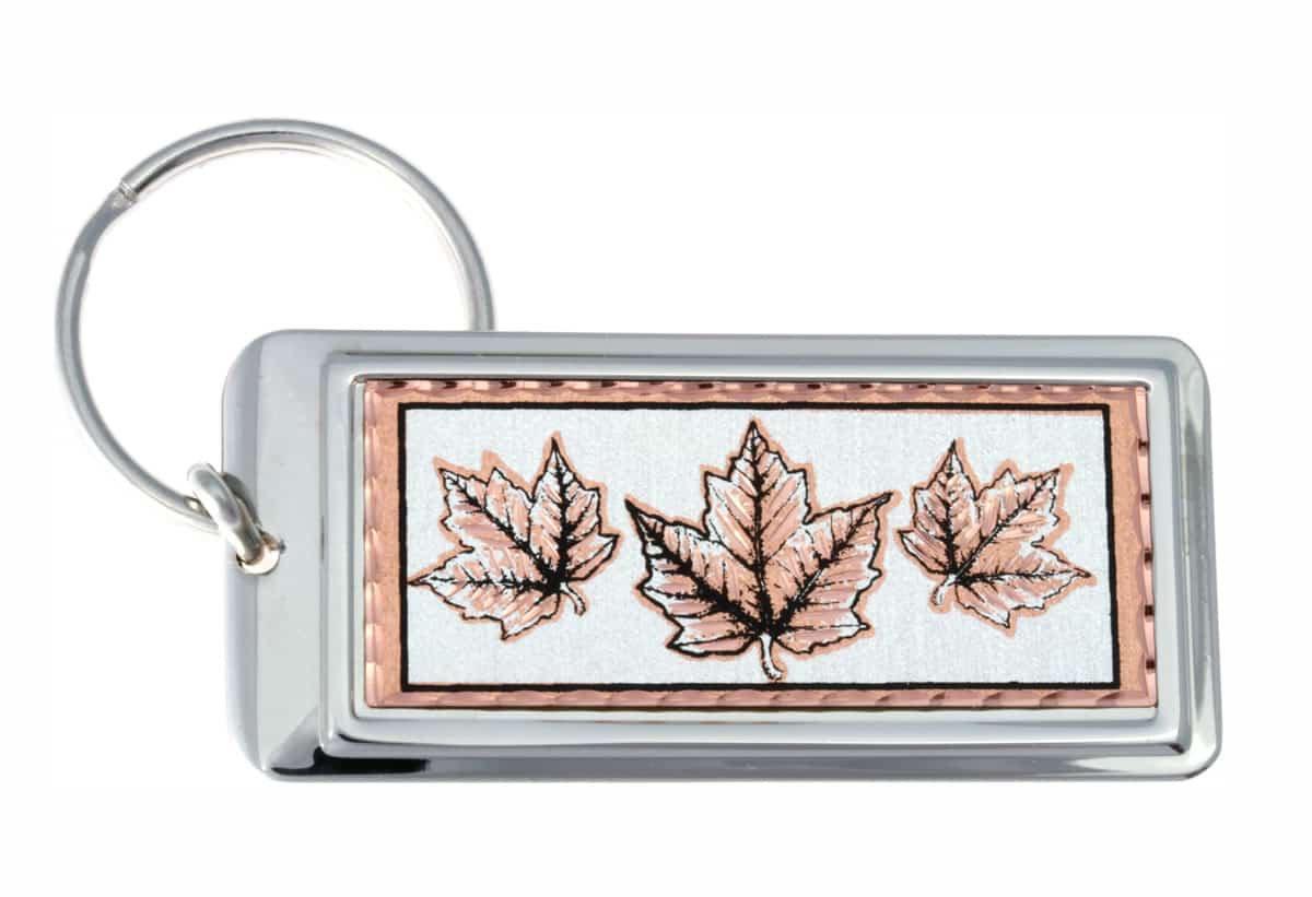 Rectangular silver-plated keychains decorated with copper maple leaves artwork Rectangular silver-plated keychains decorated with copper maple leaves artwork