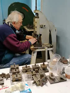 How we make copper jewelry by punching out individual pieces from raw copper sheets using precision tools