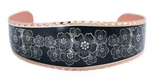 Flower bracelet made from copper with black patina background