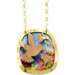 Artisan cut-out copper hummingbird sipping nectar oval pendant necklace