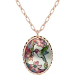 Experience the enchanting spirit of flight with this artisanal colorful copper hummingbird necklace. Skilled creators hand-forge each lovable and precious bird pendant from high-quality copper. The pretty and sweet design features alluring translucent colors that make this an outstanding piece of art.
