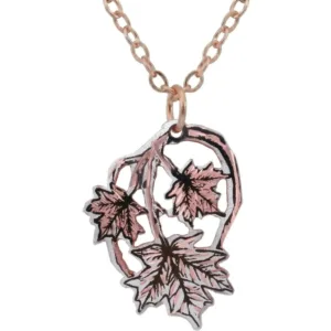 Stunning silver-plated Canadian maple leaf necklace. Discovering how to accessorize with handcrafted necklaces brings elegant, nature-inspired artistry to your wardrobe! Handmade silver-plated copper cut-out Canadian maple leaf necklace featuring sleek black highlights and diamond-cut sparkles on a chain.